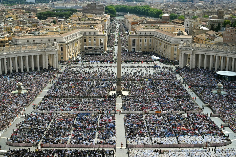 A general view shows people attending a Holy mass led by Pope Leo XIV for the beginning of his pontificate, in St Peter's square in The Vatican on May 18, 2025.