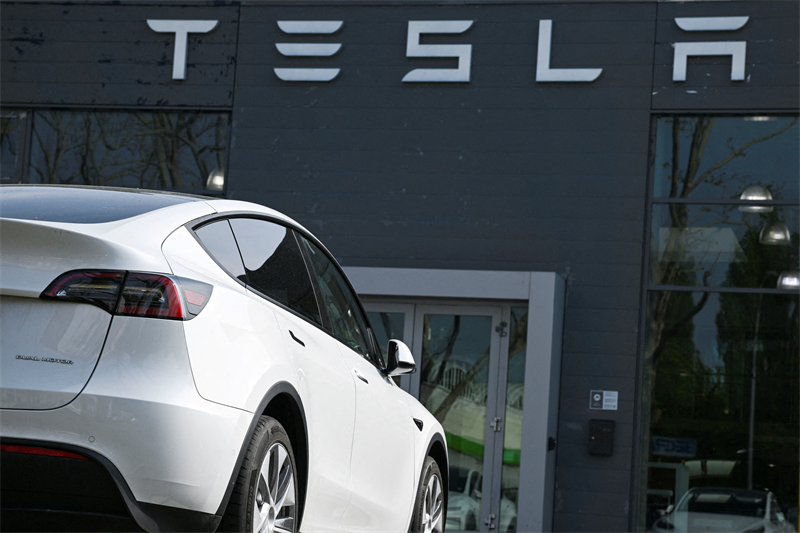 Wall Street grimpe encore avant la Fed, dopé par Tesla